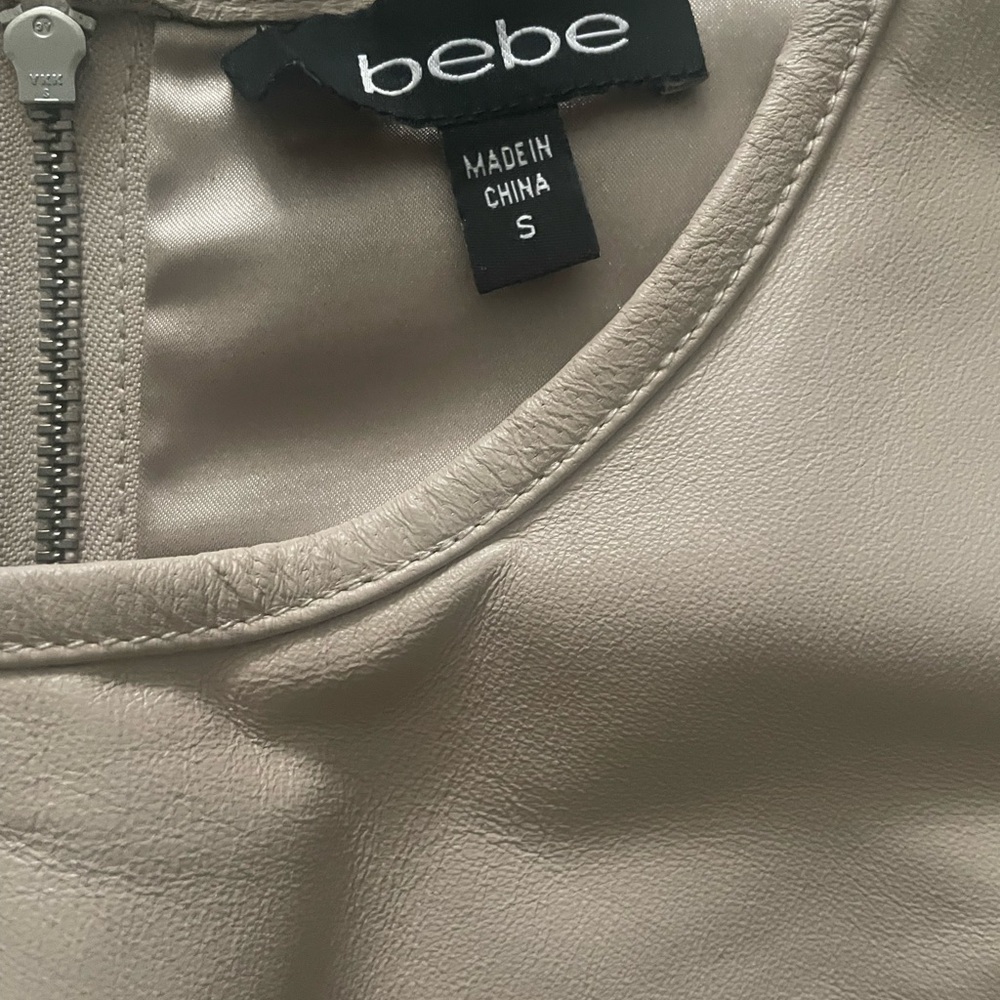Brand new small blouse , ivory lether material